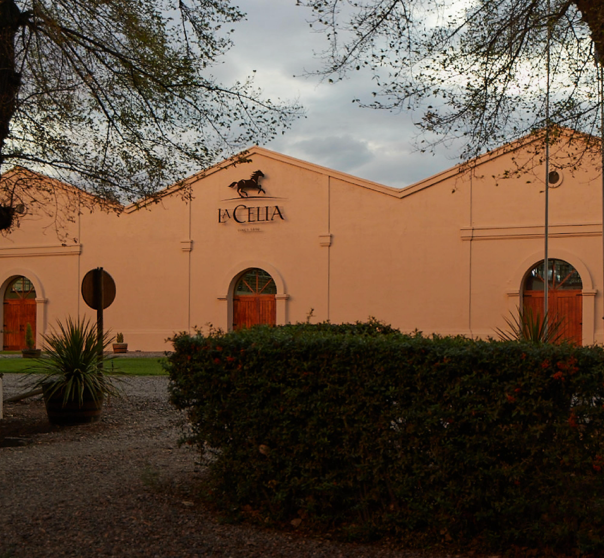 Building with 'La Celia' sign and logo on a cloudy day