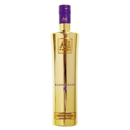 Gold bottle with purple cap on a white background