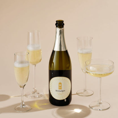 A bottle of Bimbadgen Blanc De with several glass of wine