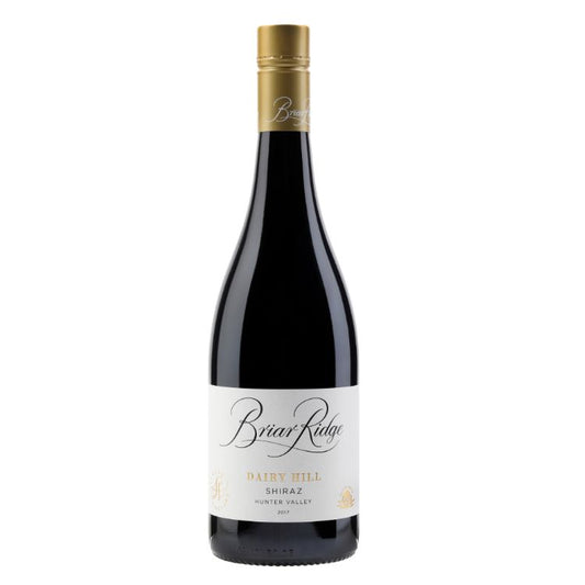 A bottle of Briar Ridge Dairy Hill Shiraz 2017 wine with a label and a golden cap.