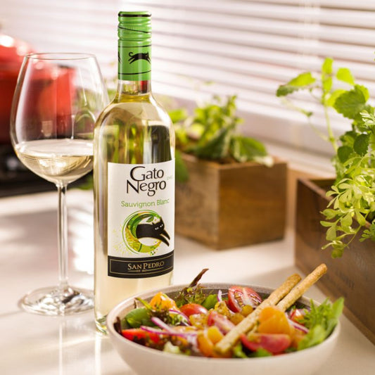 Gato Negro White Wine Sauvignon Blanc with salad and wine on side
