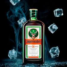 Bottle of Jägermeister liqueur with ice cubes on a dark background