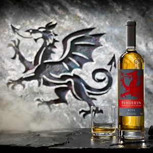 Penderyn Welsh Single Malt Whisky Dragon Range Myth with stone that has dragon drawings background