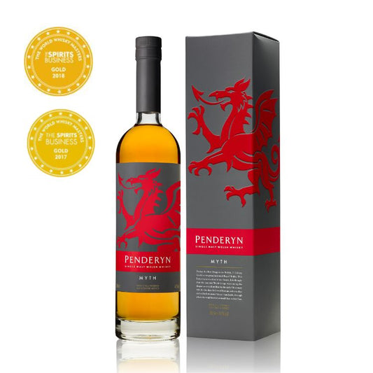 A bottle of Penderyn Welsh Single Malt Whisky, with a red dragon design, next to its packaging box, which also features the red dragon emblem. There are two award seals displayed in the top corner indicating accolades.