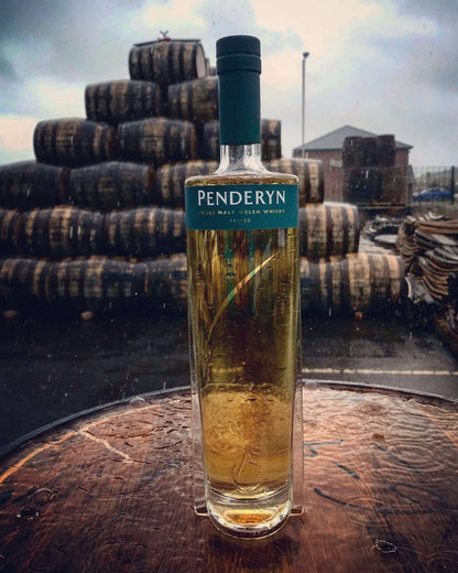 Barrel background with Penderyn Welsh Single Malt Whisky Peated Gold Range 
