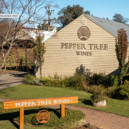 Pepper Tree Wines building with a wooden sign in front