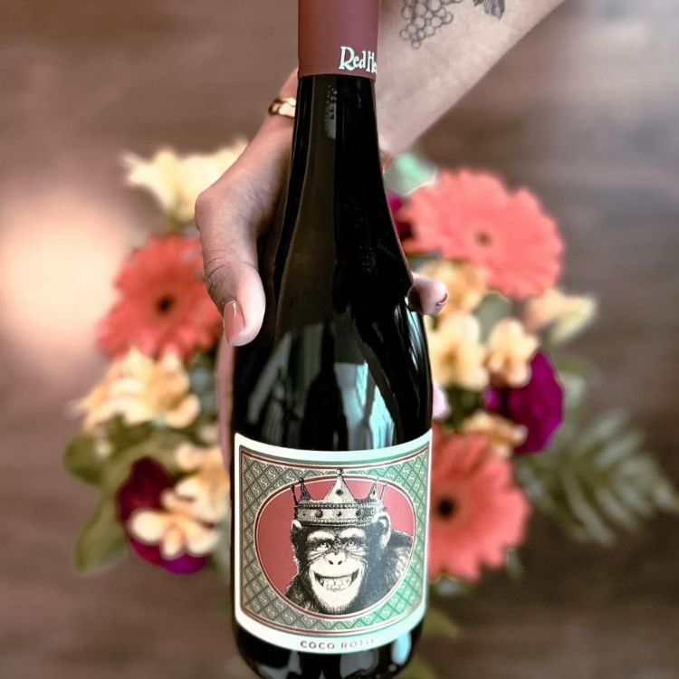 Redhead Coco Rotie 2019 Red Wine with flower background