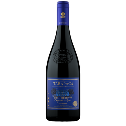 Bottle of Tarapaca Gran Reserva Red Blend wine with a deep ruby label and blue text indicating the variety of grapes.