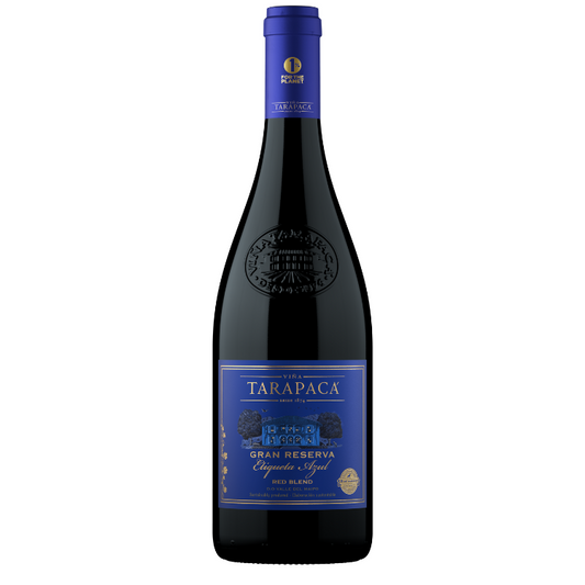 Bottle of Tarapaca Gran Reserva Red Blend wine with a deep ruby label and blue text indicating the variety of grapes.